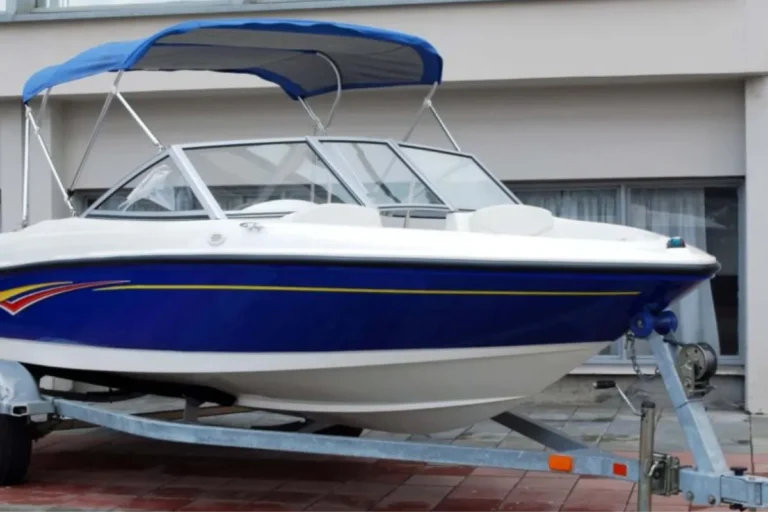 Blue and white boat protected with boat paint protection film.